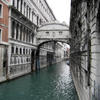 Buildings connected across a canal by Ponte dei Sospiri