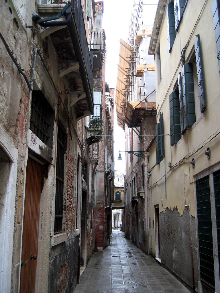 Buildings frame a narrow walkway (which leads nowhere, unless you have a boat)!