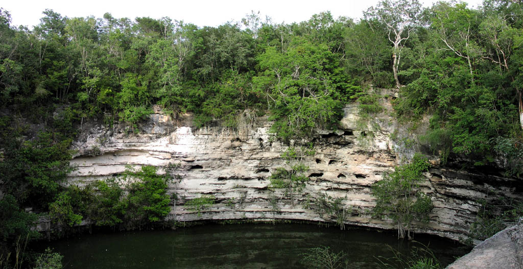 Panorama of Sacred Cenote (Sinkhole), approx. 66m diameter and 43m depth.