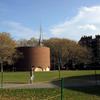 A man walks in front of Eero Saarinen's Chapel at MIT