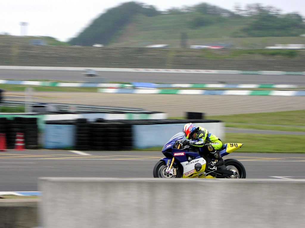 Road Race - A racer checks to see that he's alone