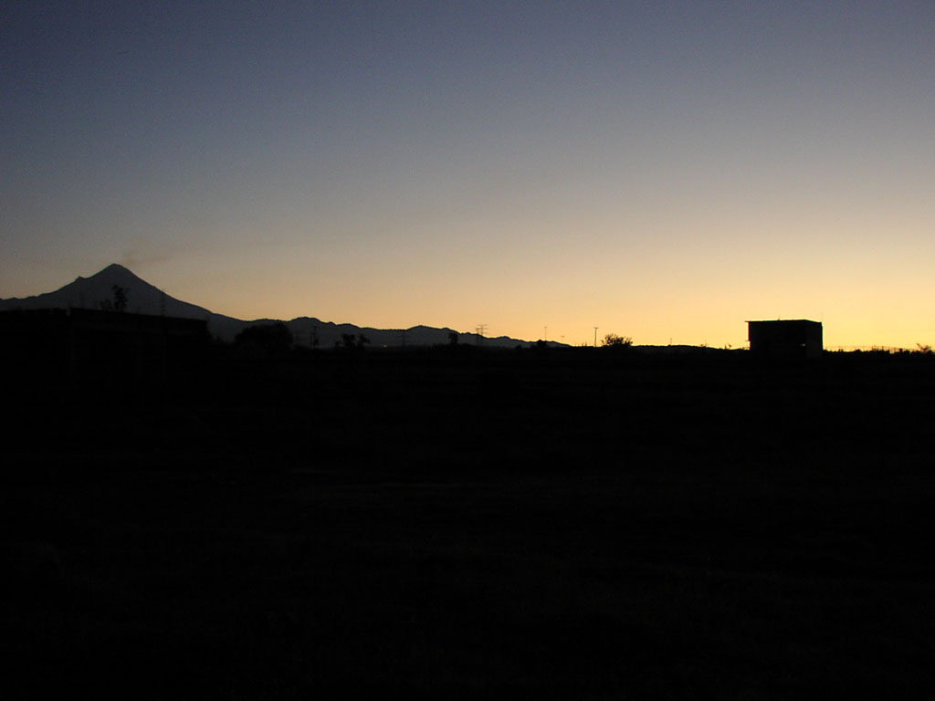 The 5,426m active volcano Popocatepetl smokes at dawn