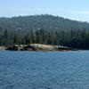People boating near a small peninsula formation
