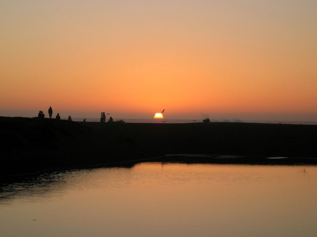 Rodeo Beach - People and bird silhouettes frame a spectacular California sunset