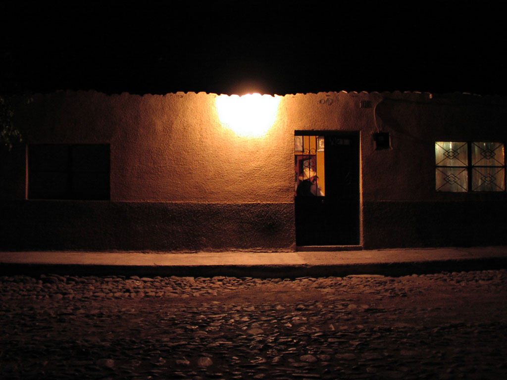 The outdoor light hints at the activity inside this small house