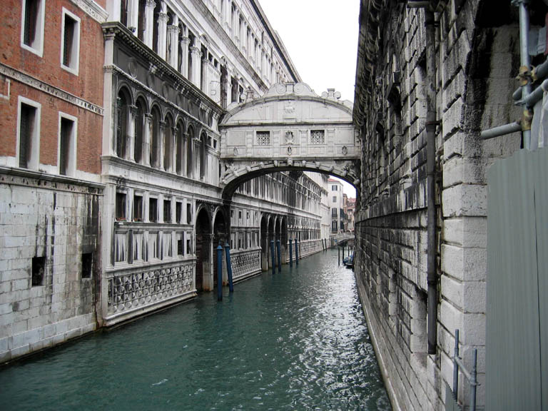 Buildings connected across a canal by Ponte dei Sospiri
