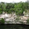 Panorama of Sacred Cenote (Sinkhole), approx. 66m diameter and 43m depth.