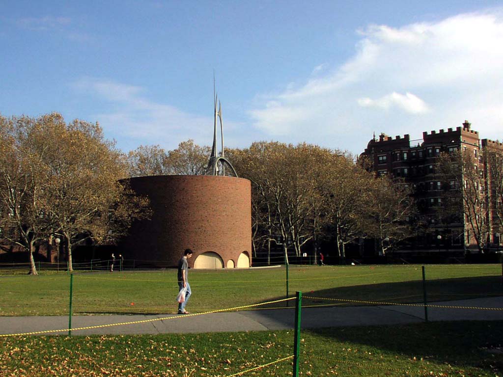 A man walks in front of Eero Saarinen's Chapel at MIT