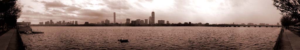 A lonely rower on the Charles River, panorama towards Boston