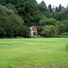 Kairakuen Park - Structure shadowed by lush forest
