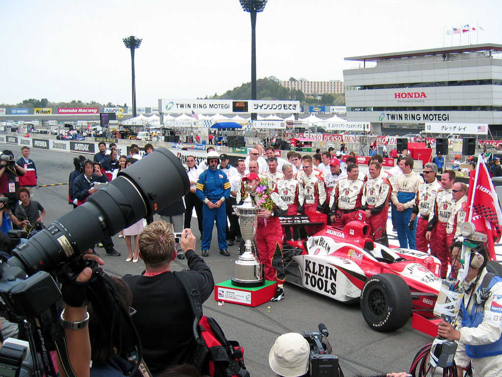 Indy 300 - The winner tastes victory, and the trophy
