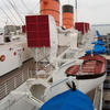 RMS Queen Mary - View of lifeboats and smokestacks from one of the top decks